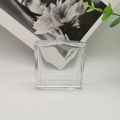 China 100ml perfume glass bottle spray cosmetic flat shoulder square spea glass bottle for sale