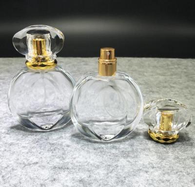 China Cosmetic Round Shoulder Empty Transparent Glass Perfume Bottles Bulk E Hot Selling for sale