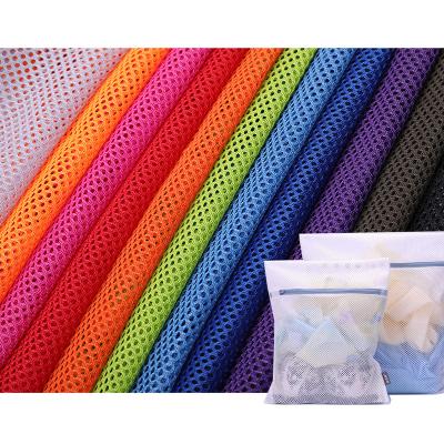 China Sturdy 100% Polyester Round Hole Anti-Static Laundromat Bags Wash Bag Mesh Fabric For Laundry Bags for sale