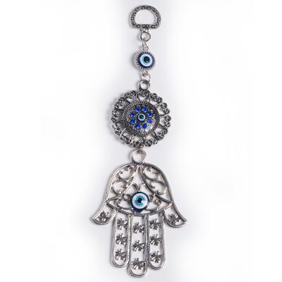 China Religious Lucky Hamsa Evil Eye Wall Hanging Alloy Fatima Fatima Cavity and Evil Eye Gift for sale