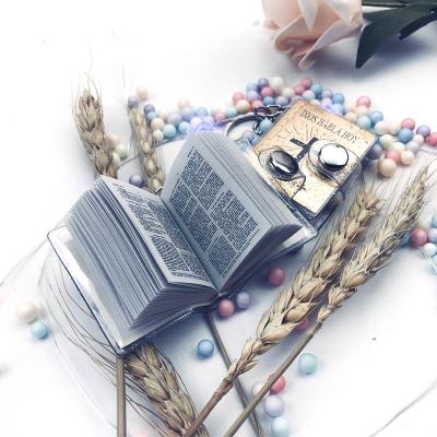 China Religious Gifts Mini Holy Bible Book Keychain of Religious English Spanish Words for sale