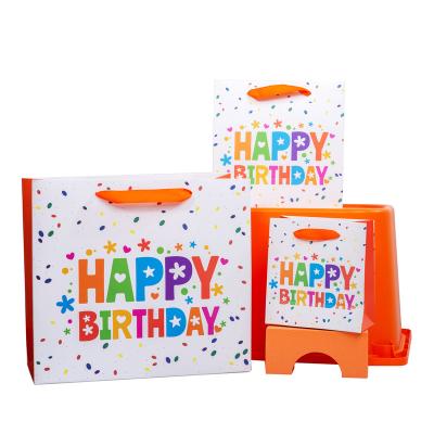 China Recyclable Customized Medium Logo Birthday Gift Glossy Paper Bag for sale