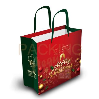 China Custom Best Selling Style Gift Art Paper Christmas Festival Merry Christmas Paper Bags Candy Recyclable for sale