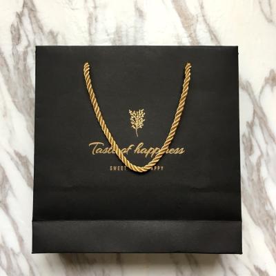 China Recyclable Hot Foil Stamping Custom Logo Print Paper Bag Handle Luxury Black Gold Shopping Paper Bag for sale