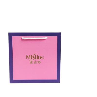 China Recycled materials custom luxury clothing retail bag packing gift bag pink bolsas de papel shopping packaging paper bags with handles for clothes for sale