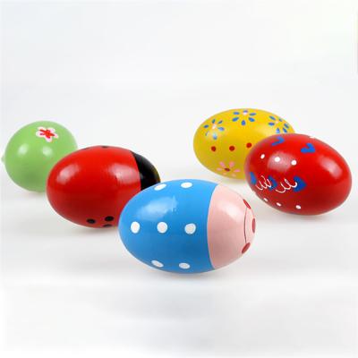 China Musical Instrument Solid Egg Shaker Early Education Toys Wooden Natural Sand Egg Set for sale