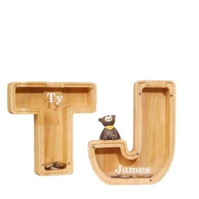 China Personalized Modern Luxury Toy Alphabet Wooden Kids Piggy Bank Coin Box Piggy Bank for sale