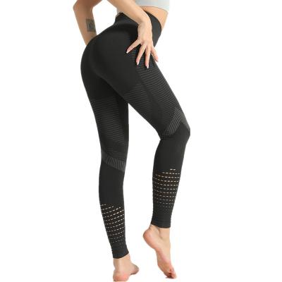 China 2021 European and American size high hips breathable peach explosive slim feet striped seamless cavity yoga leggings women for sale