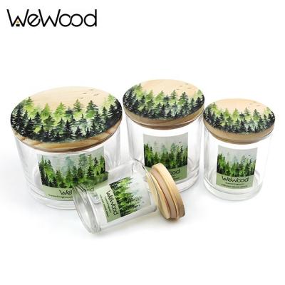 China Fashionalbe Custom Printing Scented Candle Container Frosted Empty Clear Wood Lid Glass Candle Jars for sale