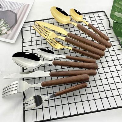 China Sustainable Serving Wooden Handle Forks And Spoons Cutlery Stainless Steel Flatware Dinnerware Sets for sale