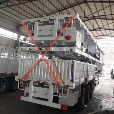 China Detachable Sidewall Tri-Axle Flatbed Semi Trailer with Heavy Mechanical Suspension for sale