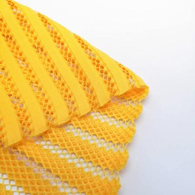 China HH-040 Memory Net Fabric Dress Apparel Material Yellow 100% Polyester Mesh Fabric For Clothing for sale