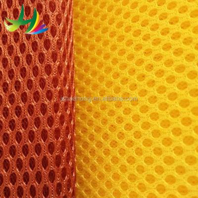 China Memory Polyester 3d Fabric Air Mesh Sandwich With Round Hole Bright Color Soft Mattress Pillow Mesh Fabric for sale