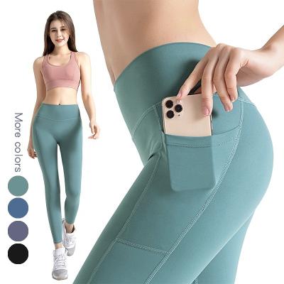 China New breathable yoga pants women; s high waist pants fishing hip side pocket sports running yoga and high hip pants wholesale for sale