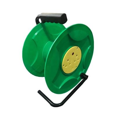 China Automatic Cable Reel Safety 25M British Type Convenient Plug 2 Outlets Hand Electric Plug Reel Cord Extension for sale