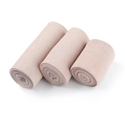 China Skin Color Medical High Compression Elastic Bandage With Aluminum Clip for sale