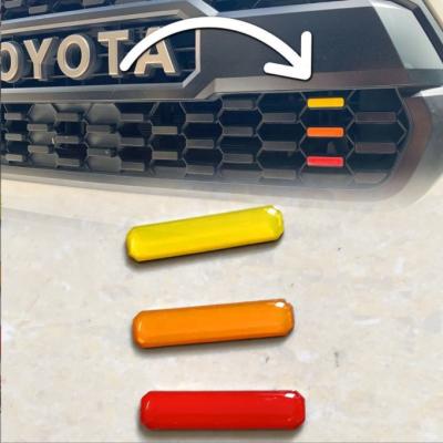 China Decorate Customized ABS Body Decoration Three Color Car Grill Emblem Badge Sticker For Tacoma for sale