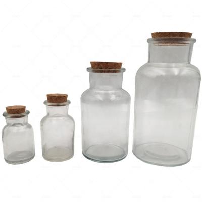 China Personal Care 250ml 500ml Clear Wide Round Mouth Apothecary Jars Reagent Glass Bottle With Cork Lids for sale