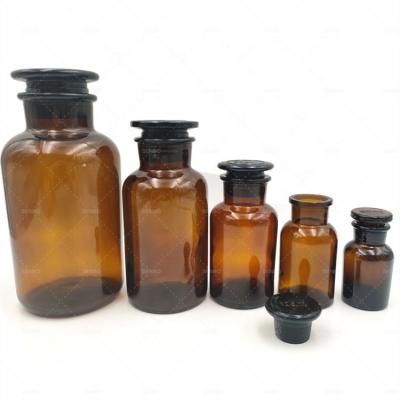 China Wide Storage Narrow Mouth Amber Glass Apothecary Jar Laboratory Pharmacy Reagent Bottle With Glass Lid for sale