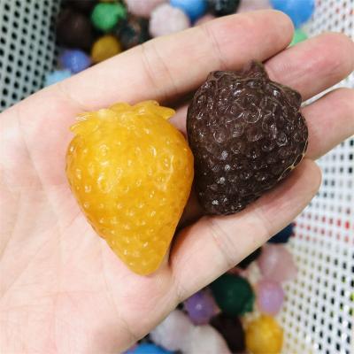 China Dong Hai tumbled stones carving crystals folk handicraft rose quartz cutter which caved strawberry-shaped jade of different colors for sale