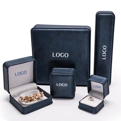 China Custom Made Box Luxury Logo Necklace Navy Key Lock Blue Ring White Light Big Fashion Jewelry With PU Leather for sale