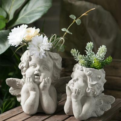 China Small Beautiful Traditional Durable Baby Angel Statue Cement Flower Pots of Outdoor and Indoor Decoration for sale