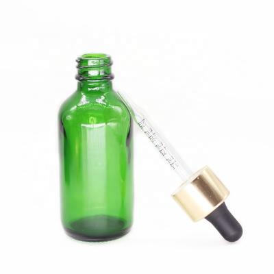 China Recycable Green 2oz 60ml Boston Round Glass Bottles With Gold Foil Glass Dropper For Essential Oil for sale