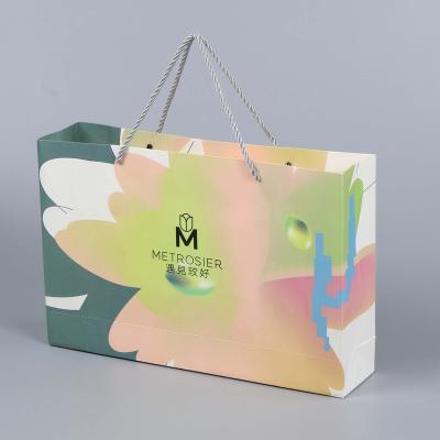 China Recycled Materials Customized white card stock sturdy and durable Eco-friendly clothing pacing packaging bags for clothing businesses for sale