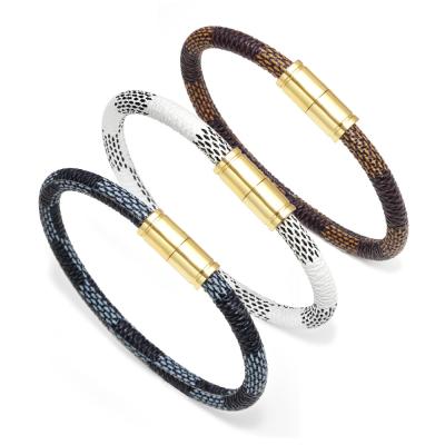 China Amor Trendy Jewelry Wholesale Cow Stripe Alloy Magnet Leather Clasp Couple Bracelet for sale