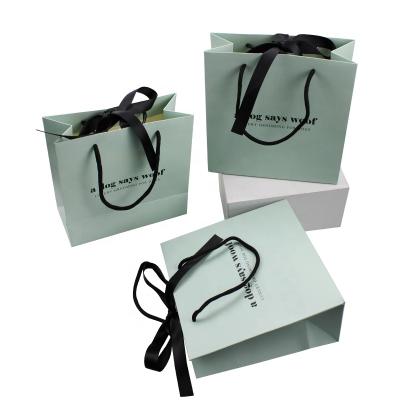 China Recyclable Ribbon Handle Kraft Paper Luxury Gift Bags Craft Custom Boutique Printing Paper Shopping Bag With Logos for sale