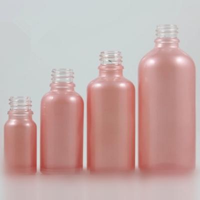 China Personal Care DIN18 Neck 10ml 30ml 50ml 100ml Frosted Pink Glass Essential Oil Dropper Bottle for sale