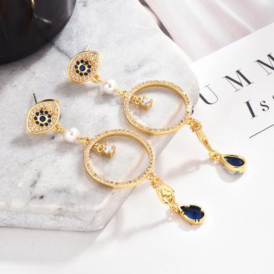 China Luxury Fashion Trendy Zircon Long Earrings Fine Jewelry Gold Color Rhinestone Evil Eye Stud Earrings For Women for sale