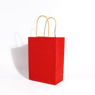 China Recycled Materials Red  Kraft Paper Twisted Handle Recyclable Paper Bag With Full Color Printing for sale