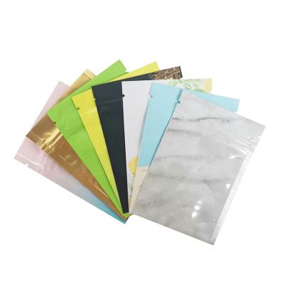 China Three Side Resealable Moisture Proof Smell Proof Metallic Mylar Aluminum Foil Zip Lock Holographic Plastic Bag for sale