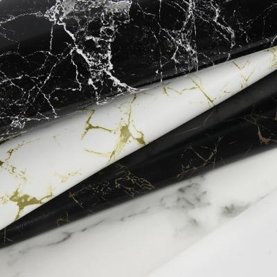 Chine 0.7mm imperméable à l'eau en PU en cuir synthétique Faux Matte Marble à vendre