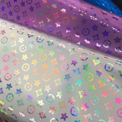 Cina Borsa a mano Laser Engrave PU pelle colorata Pentagono Fiore pelle artificiale PU in vendita