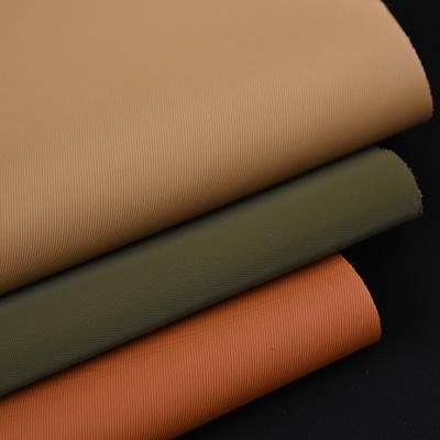 China Tesoura impermeável de nylon macio textura de couro semi-PU Borracha de fundo de bolso de mão de couro falso à venda