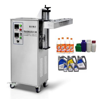 中国 Automatic Electromagnetic induction aluminum foil sealing machine 販売のため