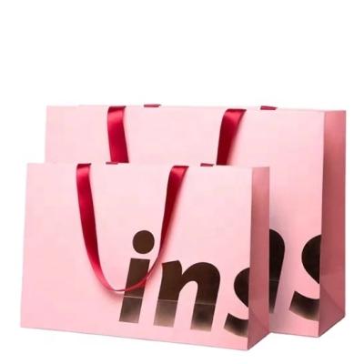 China Recycled Materials Customized LOGo Luxury Hot Pink Rose Gold Gift Packaging Bag Wedding Party Favor Bag for sale