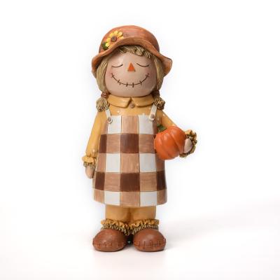 China Resin Thanksgiving Baby Scarecrow Girl Fall Harvest Decoration Polyresin Holiday Decor for sale