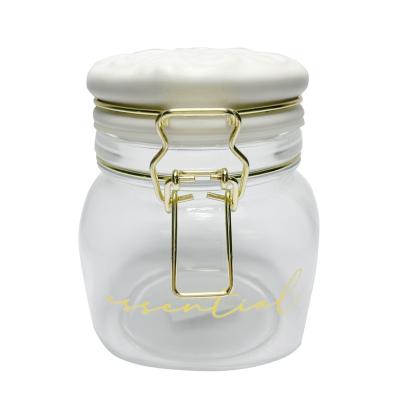 China Circle Seal Glass Jar Replacement Buckle Airtight Glass Jar With Flip Top Wooden Lid For Storage Candy Cookie for sale