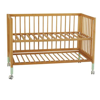 China CJ-C024 Solid Wooden Baby Crib Healthy Wooden Baby Crib With Green Wheels for sale