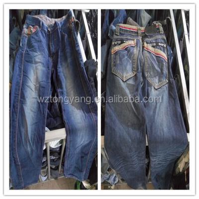 China Fashion and popular hot sale jeans overstock second hand clothes in UK used adult dresses for sale