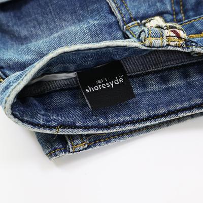 China Sustainable Jeans Dresses Nonwoven Labels Label For Fabrics Custom Size Fashion Clothes Label for sale