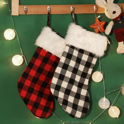 China Christamas Home Decor Gift Bag Monogram Black and Classic Red Plaid Plush Christmas Checkered Stocking Pops Kids Candy Bag for sale