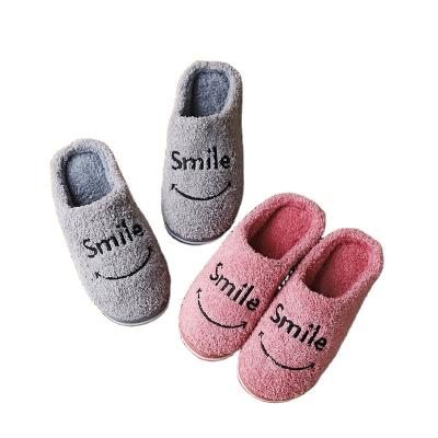 China Soft-soled plush warm home minun slippers men's and women's smile letters slippers durable smiling fashion new winter for sale