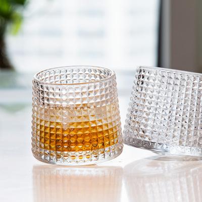 China Spinning whiskey glass Rocking glacier style diamond thick bottom spinning whiskey crystal glass gift set of 4 whisky tumbler rock glass for sale