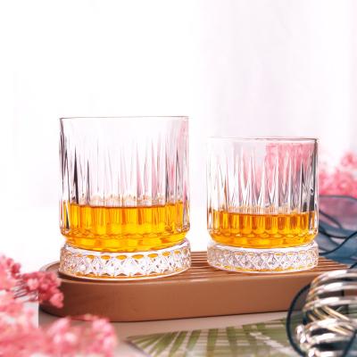 China Spinning whiskey glass Thick bottom gold rimmed old fashioned lowball whiskey glasses with ripple design engraved for sale