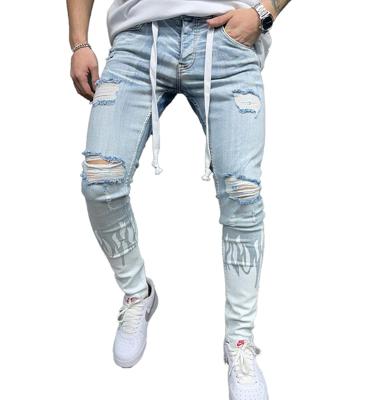 China RTS-M001 breathable ready to ship fashion ripped flame print designer skinny jeans men for sale