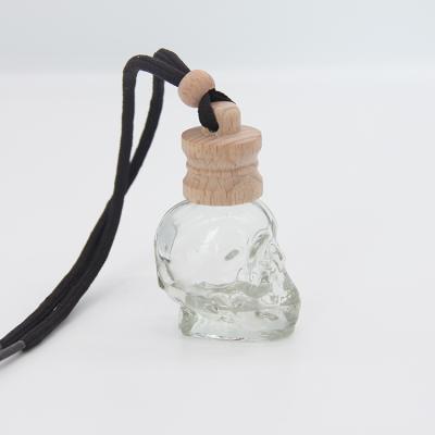 China No Puddle 5ml Customize Skull Shape Car Perfume Bottle Air Freshener Hanging In Car for sale